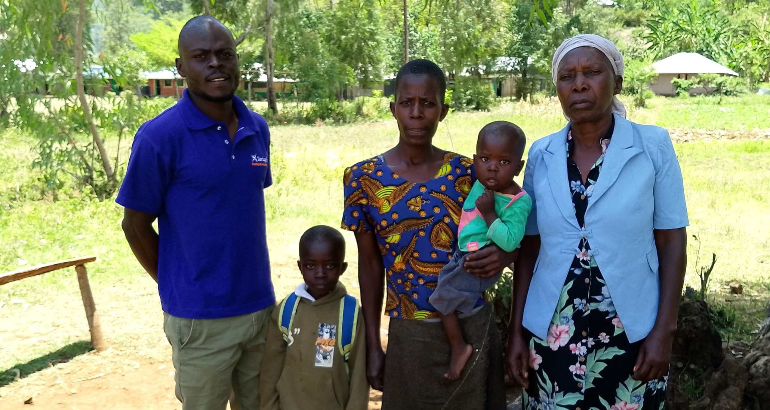Roselyne Owuor from Kisumu, Kenya with her family and Wilkista Juma Owinyo, a Community Health Promoter 