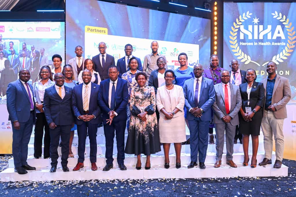 Living Goods Uganda’s Director of Advocacy and Partnerships, Amy Kakiza (C 2nd raw), joins the Minister of Health Hon. Dr. Jane Ruth Aceng (C), the PS Dr. Diana Atwiine (5th from right) and other MoH officials and partners for a group photo at the augural Africa Health Summit in Kampala.